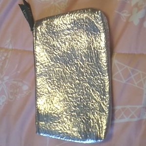 Metallic Ipsy bag, with Dark Green Color Inside The bag